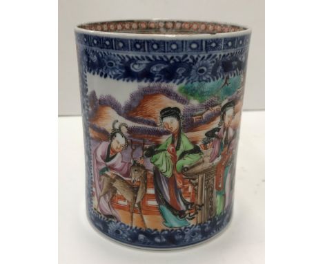 An 18th Century Chinese Kangxi polychrome decorated mug, the main panel depicting figures and young stag in a landscape, with