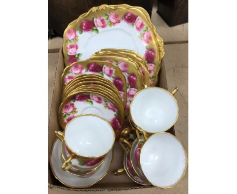 A Royal Albert Crown China Old English Rose pattern part tea set comprising eight cups and saucers, six plates, two sandwich 