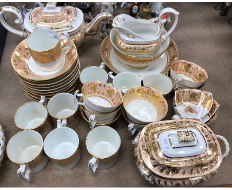 A 19th Century Derby part tea / coffee set, salmon pink and gilt banded with foliate decoration, comprising teapot, lidded su