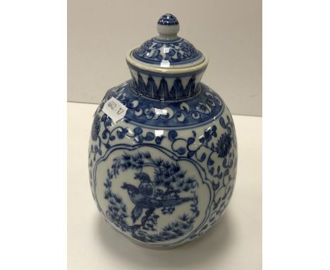 An early to mid 20th Century Chinese blossom and bird decorated vase and cover bearing six character Kangxi mark to base, wit