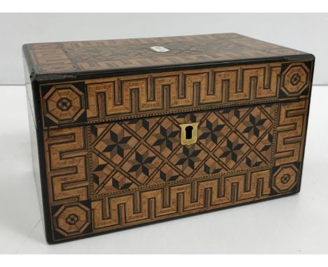 A 19th Century parquetry work two section tea caddy, the rising lid opening to reveal an interior with two lidded compartment