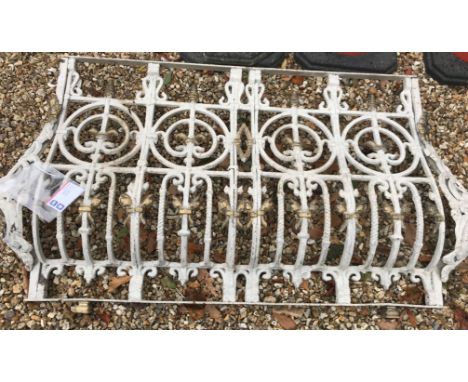 A painted wrought iron window railing section of bellied form with acanthus type leaf scrolling decoration 153 cm long x 84 c
