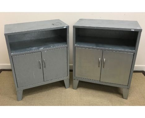 A pair of modern galvanised side cabinets, the plain top above open shelf over two cupboard doors, raised on bracket feet, 65