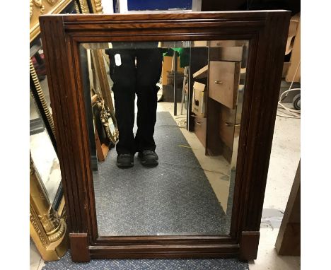 A Continental wooden wall mirror with shutter style decoration, 78 cm wide x 90 cm high together with an Italian style wall m