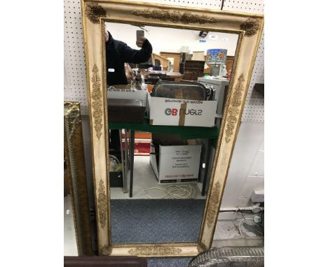 A modern rectangular gilt framed mirror, 76 cm wide x 107 cm high and a further modern wall mirror in the Continental taste, 