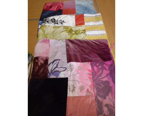A collection of seven patchwork scatter cushion covers in different colourways, including velvet patches and five various lam