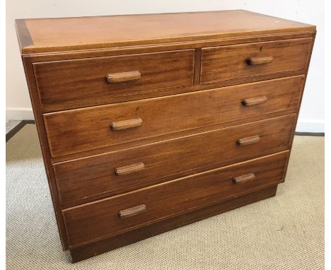 A post war teak chest of two short over three long graduated drawers with lug handles, by Gimson &amp; Slater Ltd, bearing st