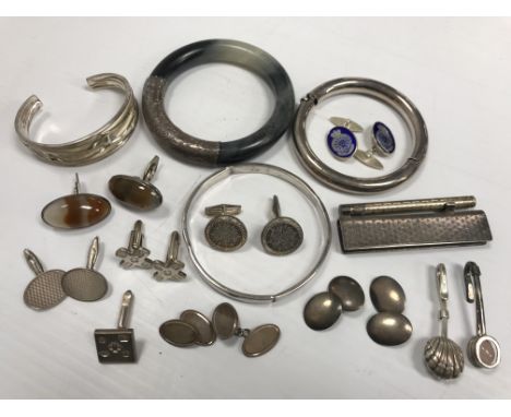 A collection of silver and white metal cufflinks, bangles, etc, to include a pair with hardstone decoration and a pair with e