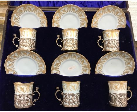 An Edwardian Royal Worcester pale blue and gilt decorated set of six coffee cans and saucers date marked for 1901 together wi