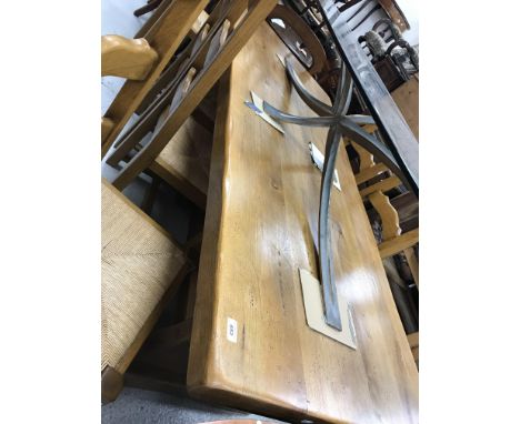 A French oak refectory style dining table in the Arts &amp; Crafts taste, the plank top on end trestle supports united by a c