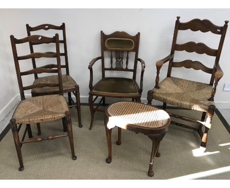 A stained beech rush seat ladder back elbow chair, two standard rush seat ladder back chairs, an Edwardian mahogany and satin