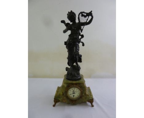 A late 19th French century spelter clock, surmounted by a classical figure playing a lyre on marble base