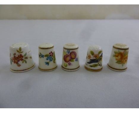 Five porcelain thimbles to include Royal Worcester and Hammersley