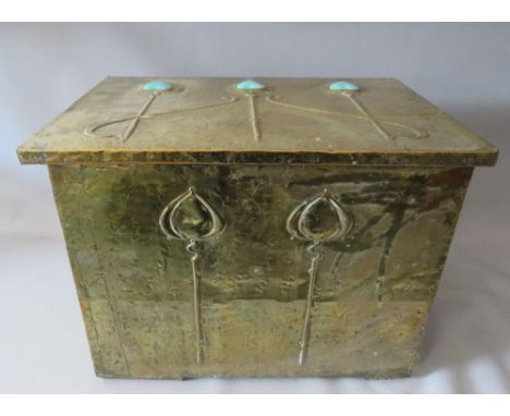 AN ARTS AND CRAFTS RECTANGULAR BRASS BOX WITH HINGED COVER, with raised foliate decoration having three inset turquoise ceram