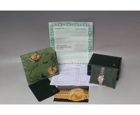 ROLEX - A LADIES OYSTER PERPETUAL DATE SUPERLATIVE CHRONOMETER, the watch having champagne dial and coming with original box,