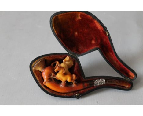 A 19TH CENTURY MEERSCHAUM PIPE, in the form of two prancing horses, with white band, in leather covered case, L 13 cm, H 5 cm