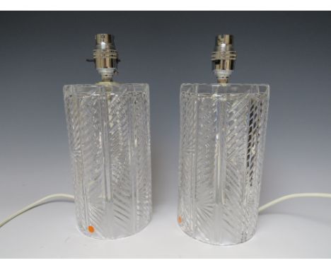 A PAIR OF WATERFORD CRYSTAL GLASS TABLE LAMPS. of cylindrical form, lamp H 20 cm, overall H 26 cm, 