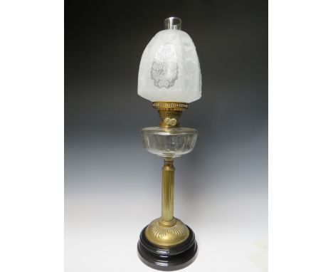 A TALL LATE 19TH / EARLY 20TH CENTURY OIL LAMP, having cut and faceted clear glass reservoir, twin T Rowatt &amp; Sons burner