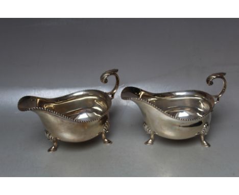 A PAIR OF HALLMARKED SILVER SAUCE BOATS BY HARRISON BROTHERS AND HOWSON - SHEFFIELD 1925,  approx combined weight 470g, W 17 