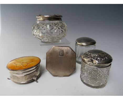 THREE HALLMARKED SILVER LIDDED VANITY JARS, together with a hallmarked silver powder compact - having engine turned decoratio