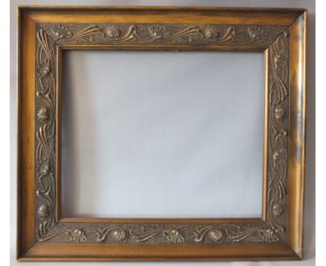 A 19TH CENTURY FRAME WITH ART NOUVEAU DESIGN IN RELIEF, frame W 12 cm, rebate 63 x 53 cm