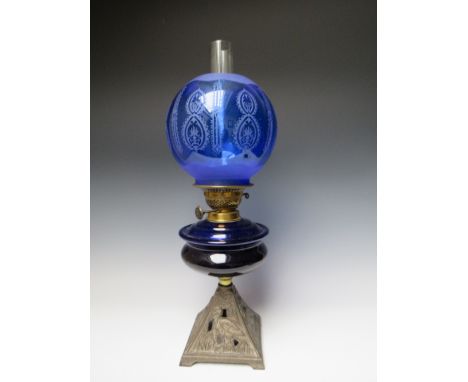 A LATE 19TH / EARLY 20TH CENTURY OIL LAMP, having Bristol blue glass reservoir, twin burner, blue glass shade with etched dec