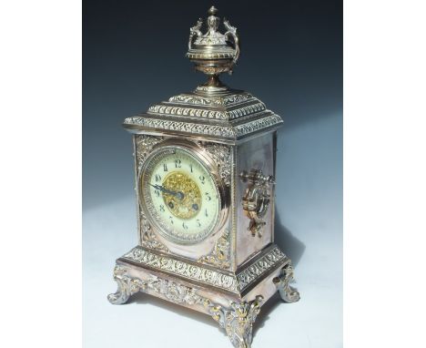 A SILVER PLATED BRASS CASED LOUIS XV STYLE MANTLE CLOCK, circa 1890, having ornate cast embellishment with enamel convex chap
