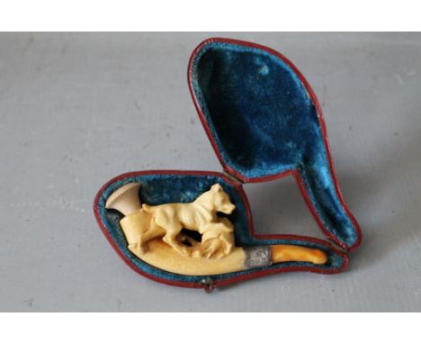 A 19TH CENTURY MEERSCHAUM PIPE, in the form of a dog, with hallmarked silver band, in leather covered case, L 11 cm, H 5 cm