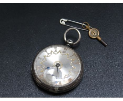 A HALLMARKED SILVER OPEN FACED MANUAL WIND POCKET WATCH, having silver dial and gold colour Roman numeral hour markers, with 