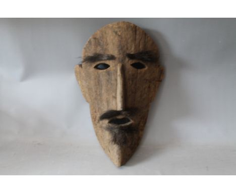 A 20TH CENTURY WOODEN FOLK ART MASK, with eyebrows, moustache &amp; bears, H 52 cm, W 37 cm
