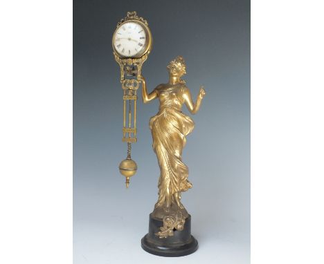 AN ART NOUVEAU FEMALE FIGURAL MYSTERY CLOCK, the gilded spelter figure with arm outstretched supporting a swinging clock by W