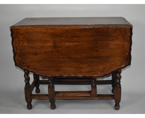 An Oak Barley Twist Drop Leaf Gate Leg Dining Table, 91cms Wide 