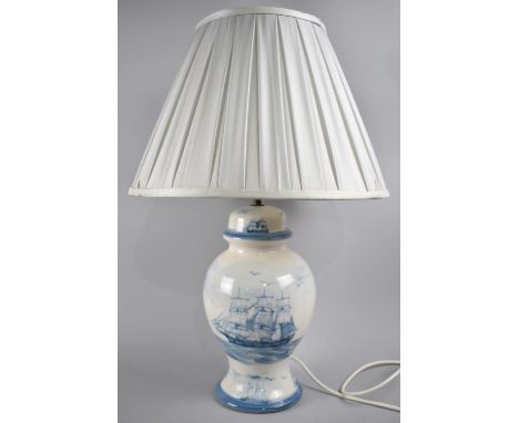 A Modern Blue and White Ceramics Vase Shaped Table Lamp and Shade Decorated with tall Ships, 56cms High 