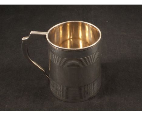 A silver tankard with engine turned banding, London 1811