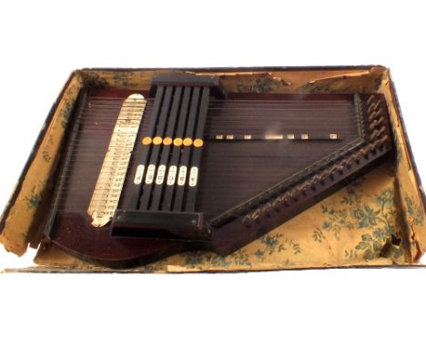 A cased German auto harp