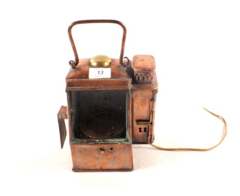 A copper carriage lamp converted to hold a Dents brass Gimbal compass