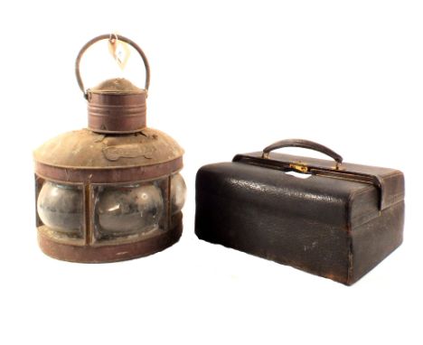 A copper ships lamp plus a leather doctors bag