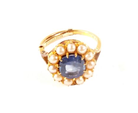 A 9ct gold cluster ring with light blue stone surrounded by small pearls, size N