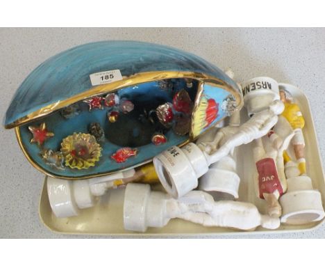 A large Vallaurais pottery shell and fish lamp plus six pottery football trophies