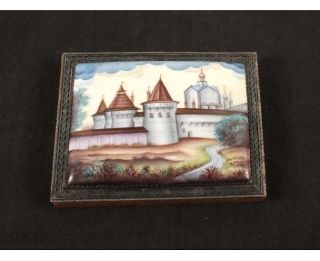 A small Russian plaque in a white metal surround, signed N.Kotkob