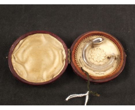 An ivory travelling barometer in a fitted leather case