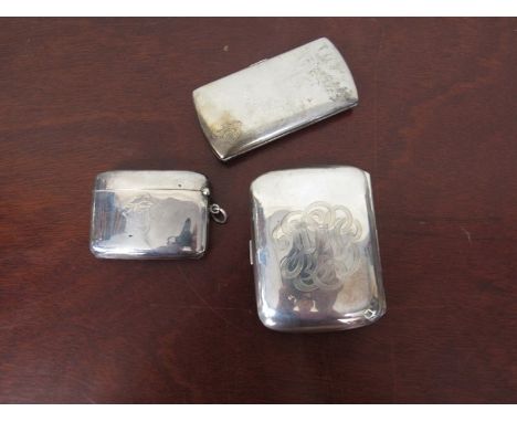 A silver vesta case and two white metal cigarette cases, one marked Sterling (3) 139g