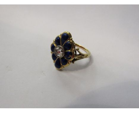 A gold ring with diamond centre .45ct approximately surrounded by blue enamelled panels, stamped 18ct (one panel has some dam