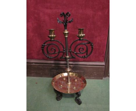 An Arts & Crafts brass and wrought iron candlestick