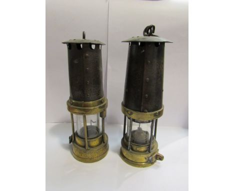Two brass and steel miners lamps, one stamped Davis, Kirkby, The other lamp missing handle