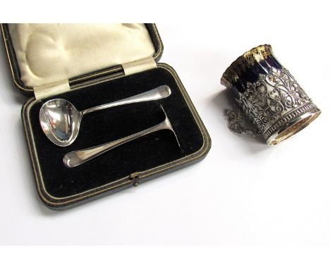 A porcelain Royal Worcester coffee can encased in silver holder 1899, boxed silver spoon and crumb scoop, Sheffield 1928