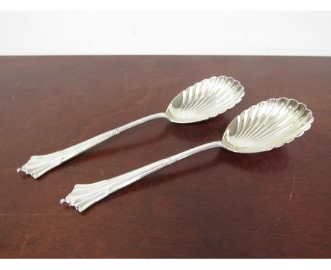 A pair of Victorian silver serving spoons with scalloped bowls, Harrison Brothers and Howson, Sheffield 1889, 191g 