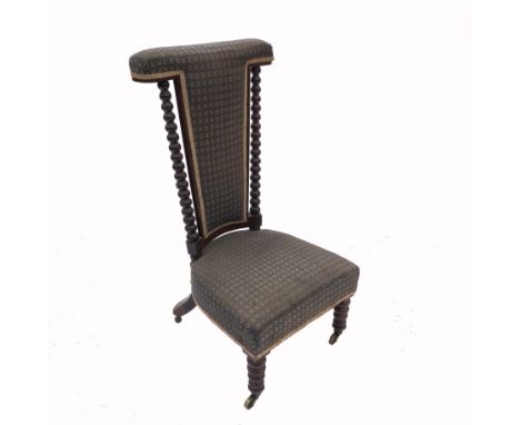 A 19th century rosewood prie dieu chair, with bobbin turned columns   Condition report:  Upholstery worn, wood worm in front 