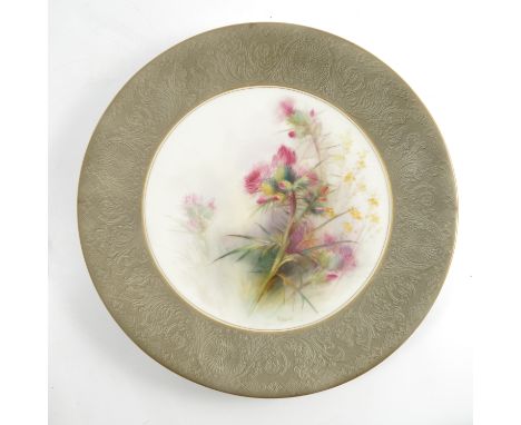 A Royal Worcester plate, decorated with Australian thistles by R Austin, with Classical border to a green grey ground, dated 