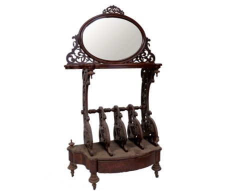 A 19th century burr walnut music canterbury, with oval mirror with shelf below, and five bar canterbury and drawer to base, w